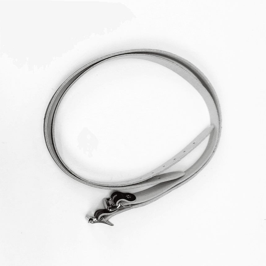 Two leather straps in a coil