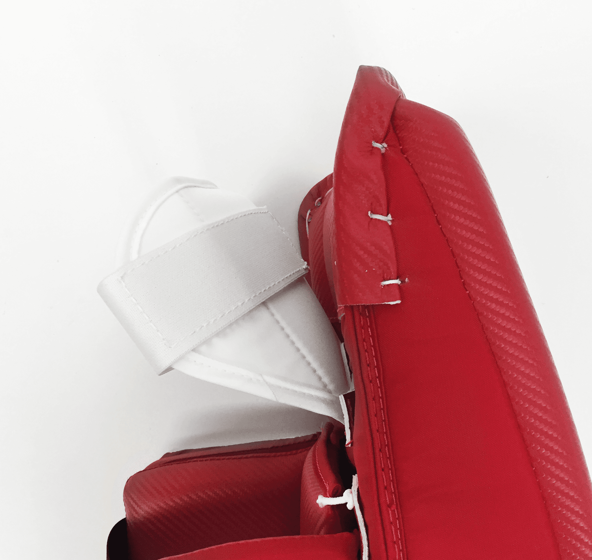 Thigh guard attached to pad - side profile