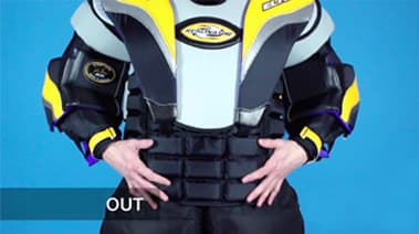 Goalie wearing chest protector outside of pants