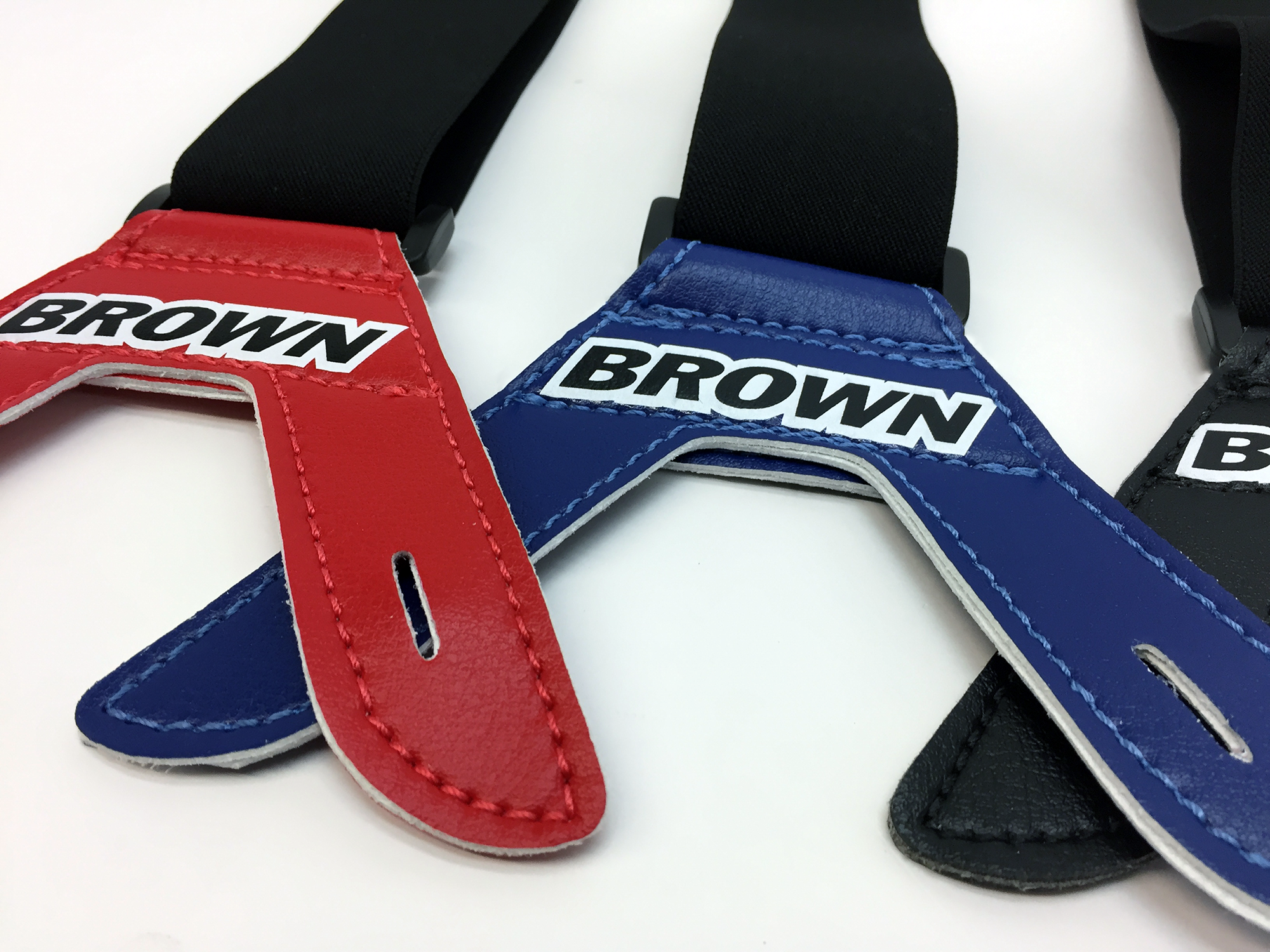 Red, blue and black leather fasteners